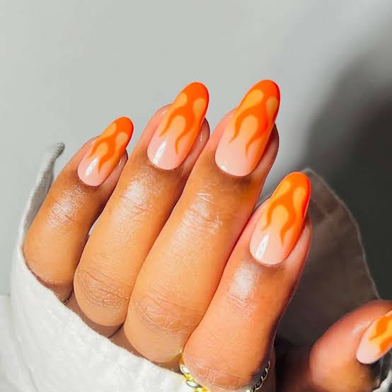 Medium Oval Sheer Nude With Bright Orange Flames Medium Oval Sheer Nude With Bright Orange Flames — Trendy Flame Nails