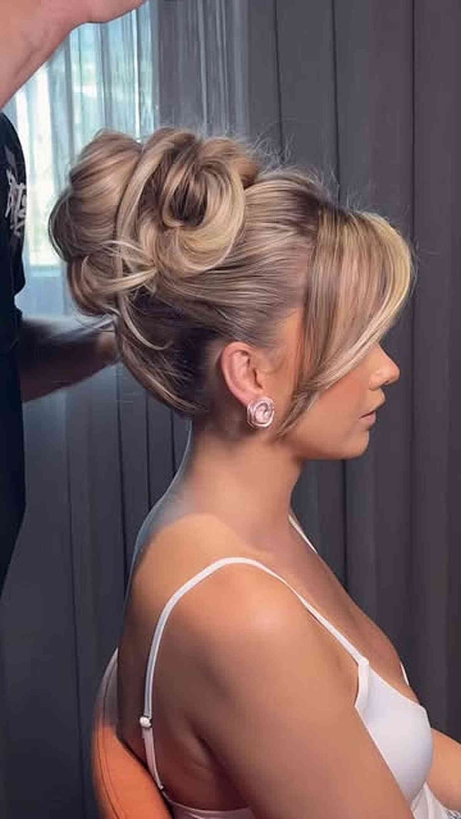 Voluminous Blonde Updo With Curtain Bangs Voluminous Blonde Updo With Curtain Bangs — Trendy Formal Hair