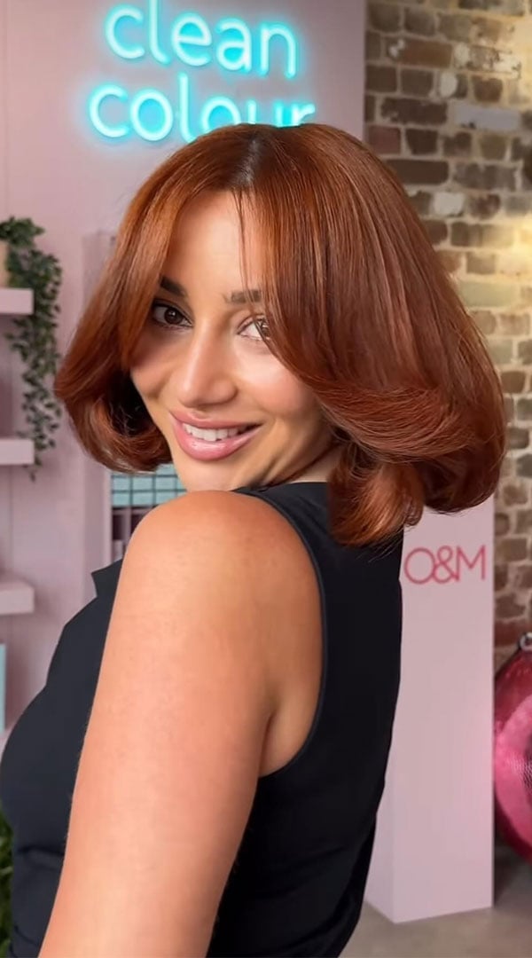 Chin Length Copper Bob With Curtain Bangs Chin Length Copper Bob With Curtain Bangs — Trendy Ginger Hair Color