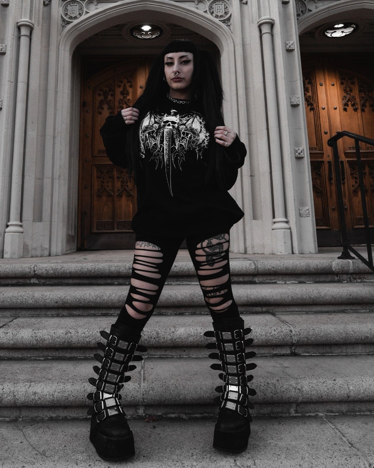 Oversized Graphic Sweatshirt With Ripped Leggings Oversized Graphic Sweatshirt With Ripped Leggings — Trendy Goth Outfits