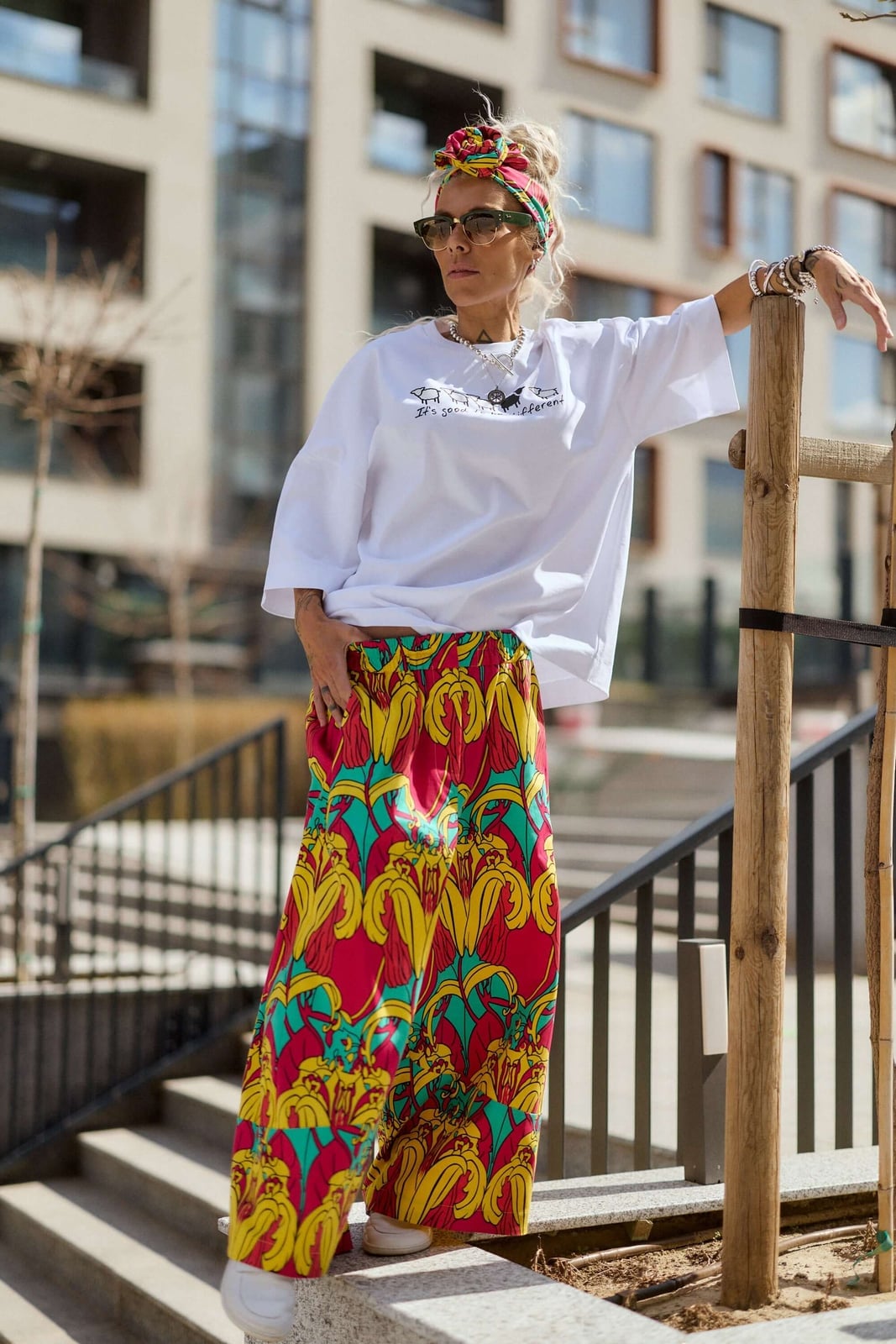 Oversized Graphic Tee with Patterned Maxi Skirt and White Sneakers — Trendy Graphic Tee Outfits