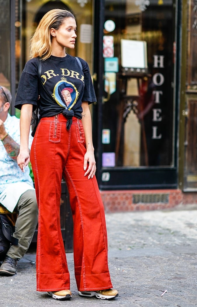 Graphic Tee Tied at Waist with Wide Leg Trousers, Close-Up Take — Trendy Graphic Tee Outfits