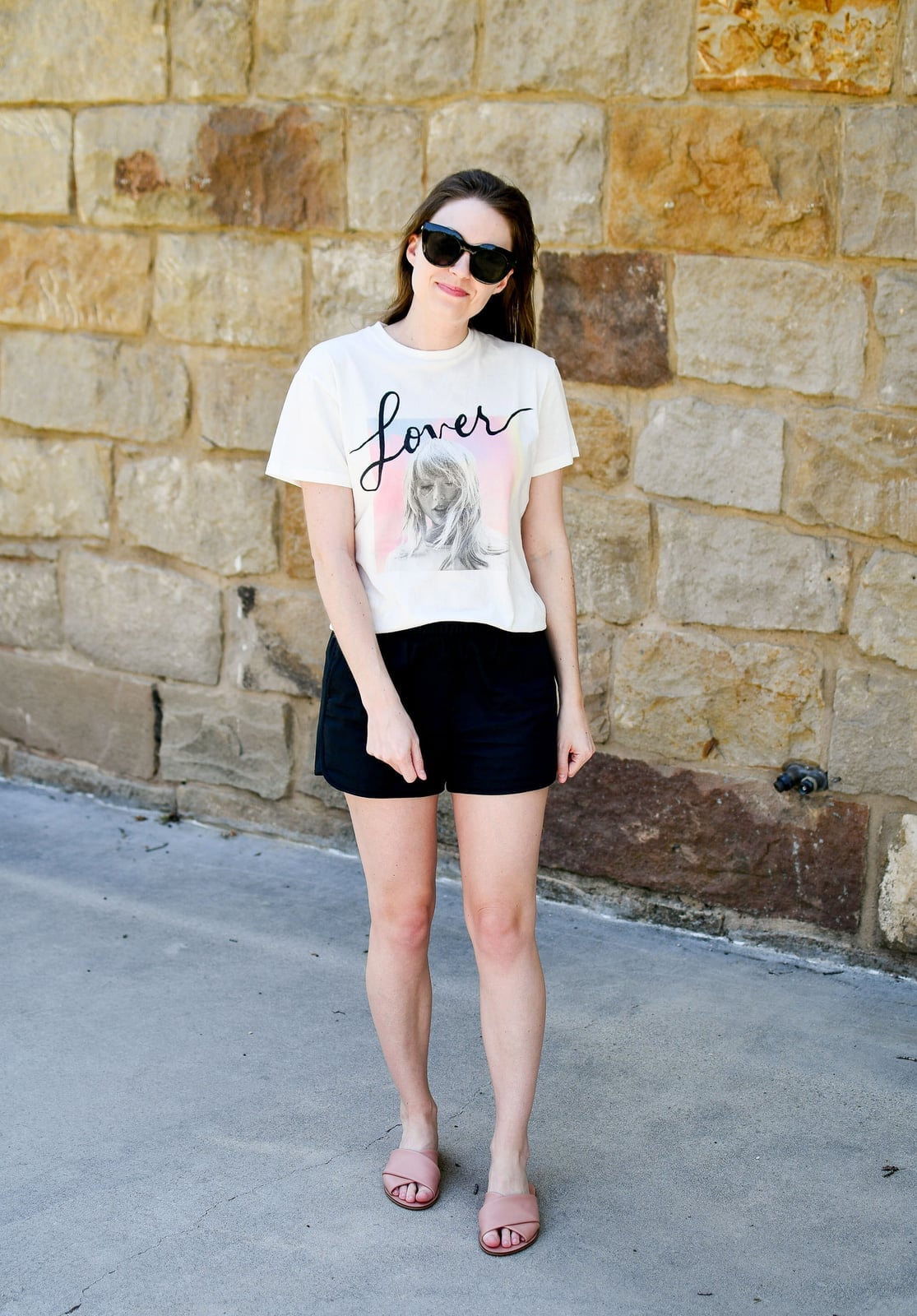Cropped Graphic Tee with Shorts and Slide Sandals, Close-Up Take — Trendy Graphic Tee Outfits