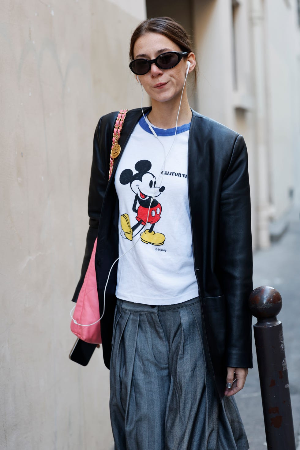 Graphic Tee Under a Leather Blazer With Grey Pleated Trousers — Trendy Graphic Tee Outfits