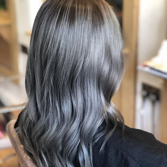 Mid-Back Ash Gray With Subtle Highlights — Trendy Gray Hair Color