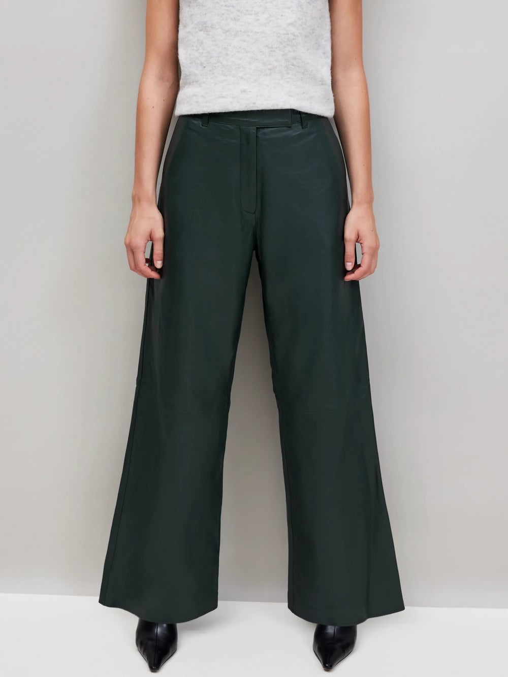 Dark Green Leather Wide-Leg Pants with Grey Sweater, Close-Up Take Dark Green Leather Wide-Leg Pants with Grey Sweater, Close-Up Take — Trendy Green Pants Outfits