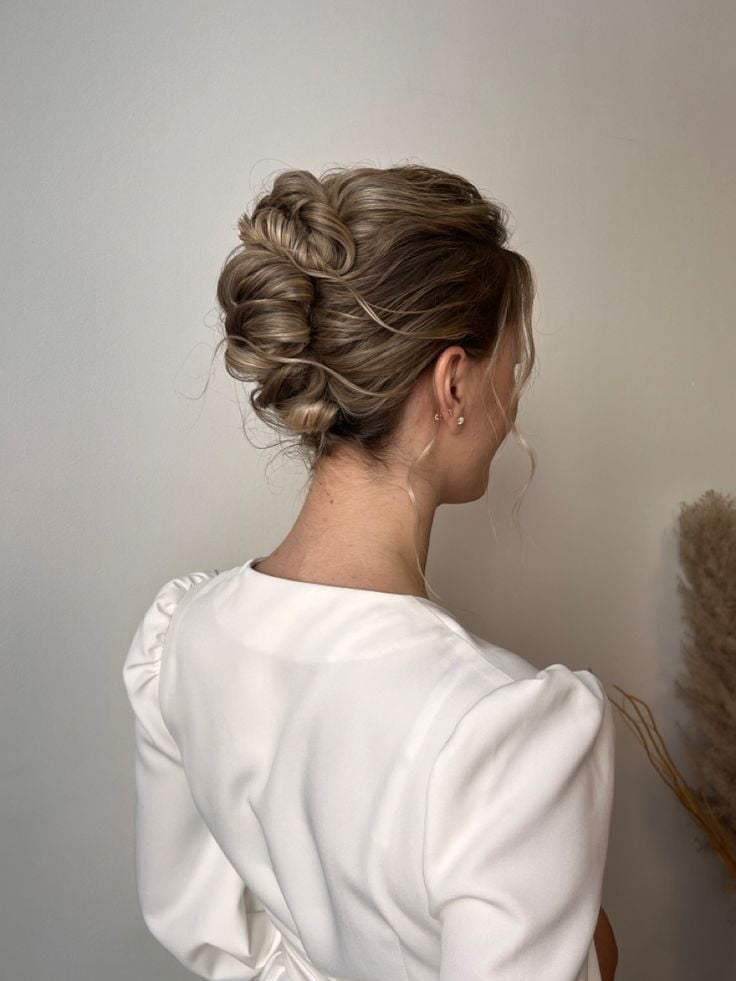 Textured Ash Blonde Updo With Rolled Sections — Trendy High Bun Hairstyles