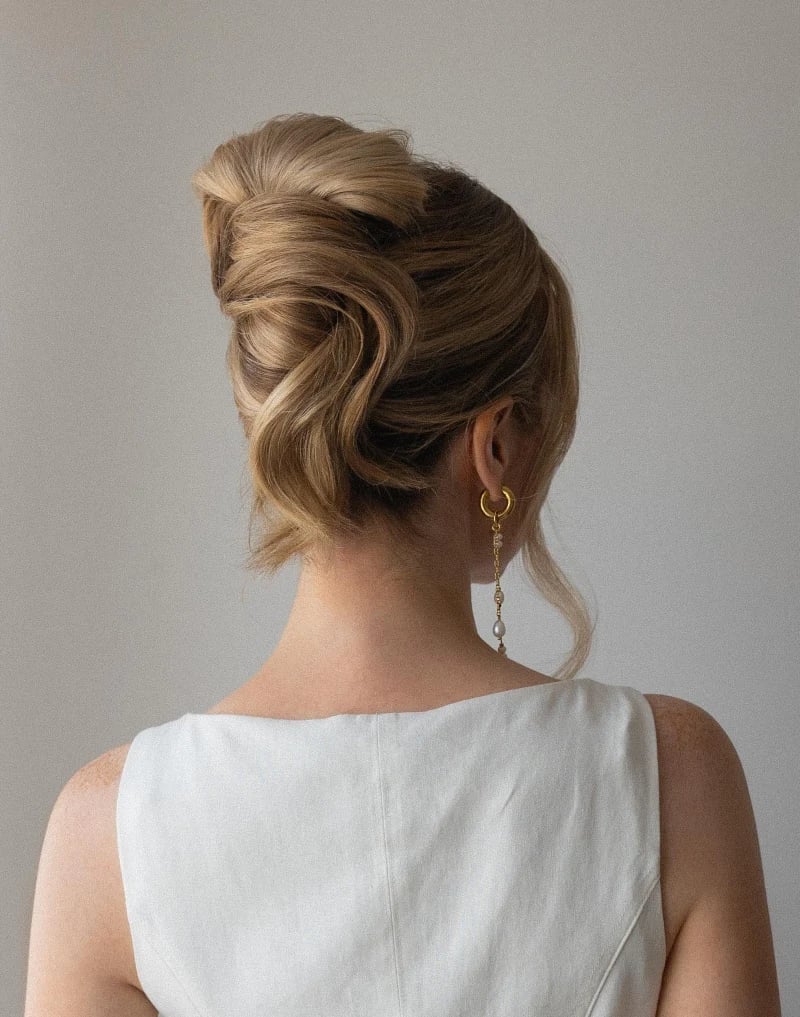 Voluminous Honey Blonde Updo With Intricate Twists — Trendy High Bun Hairstyles
