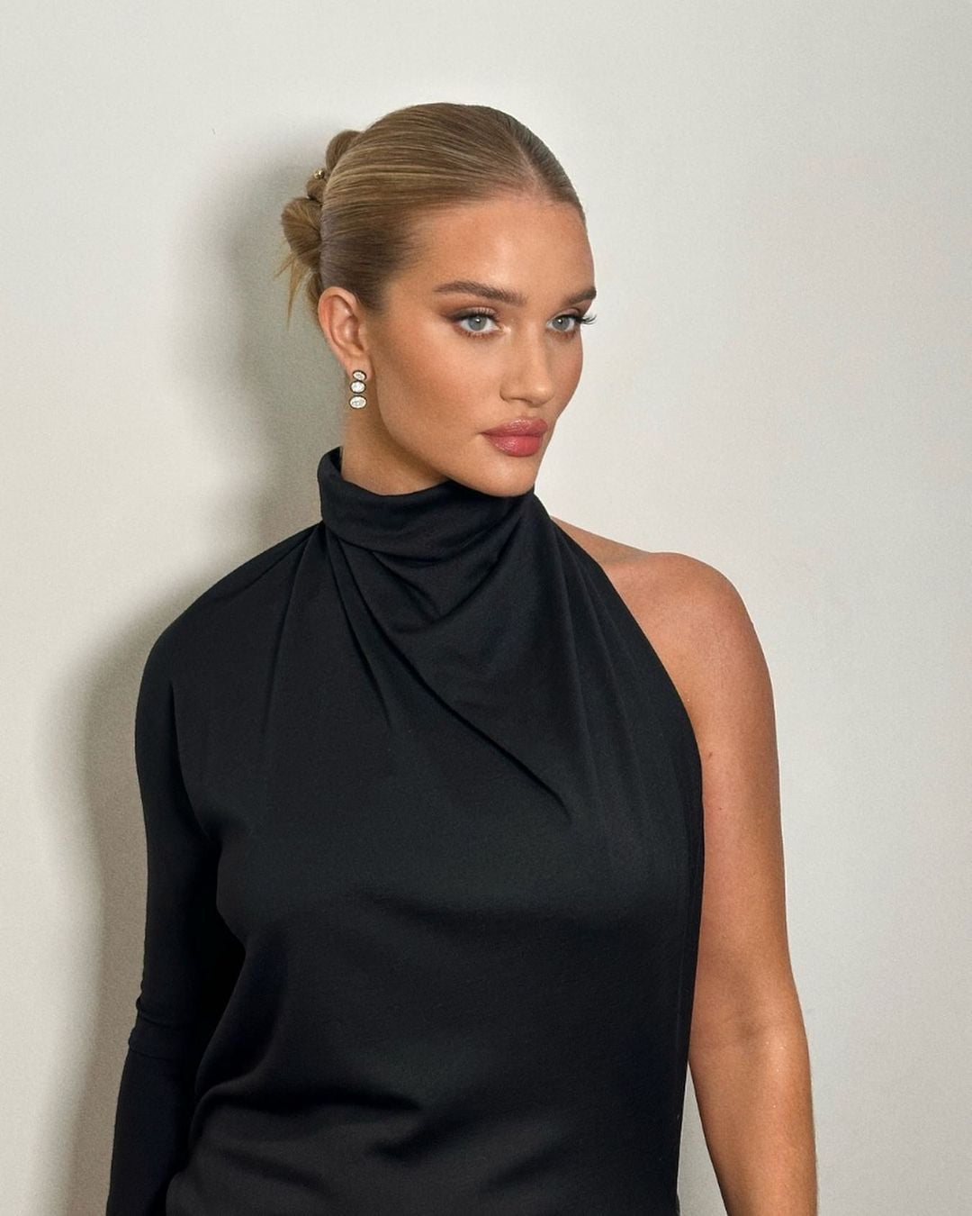 Low Volume Blonde Bun With Wispy Bangs — Trendy High Bun Hairstyles