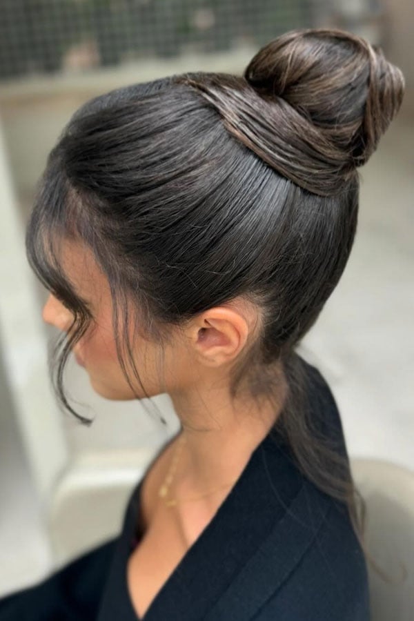 Softly Sculpted Dark Brown Bun With Tendrils — Trendy High Bun Hairstyles