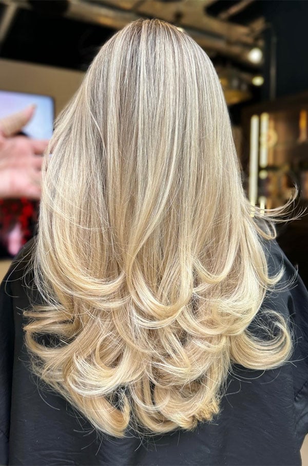 Mid-Back Waves With Subtle Blonde Highlights, Layers — Trendy Highlights Hair