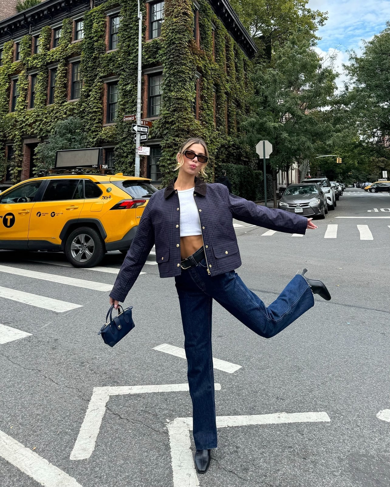 Dark Wash Straight-Leg Jeans with a White Crop Top and Quilted Jacket — Trendy Jeans Outfits