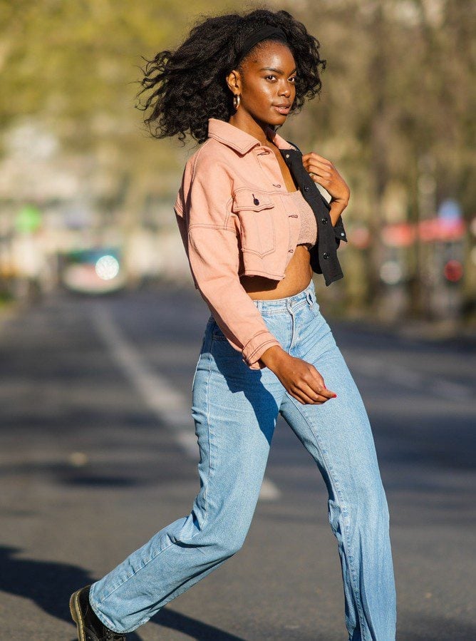 Light Blue Wide Leg Jeans with a Pink Denim Jacket and Black Boots — Trendy Jeans Outfits