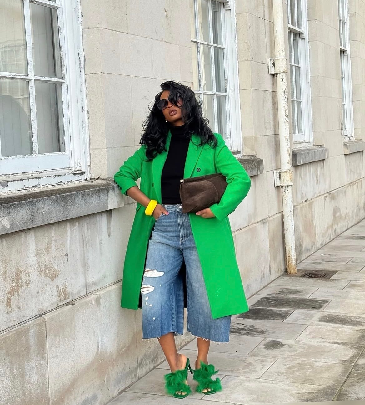 Distressed Jorts With Turtleneck And Bright Green Coat — Trendy Jorts Outfits