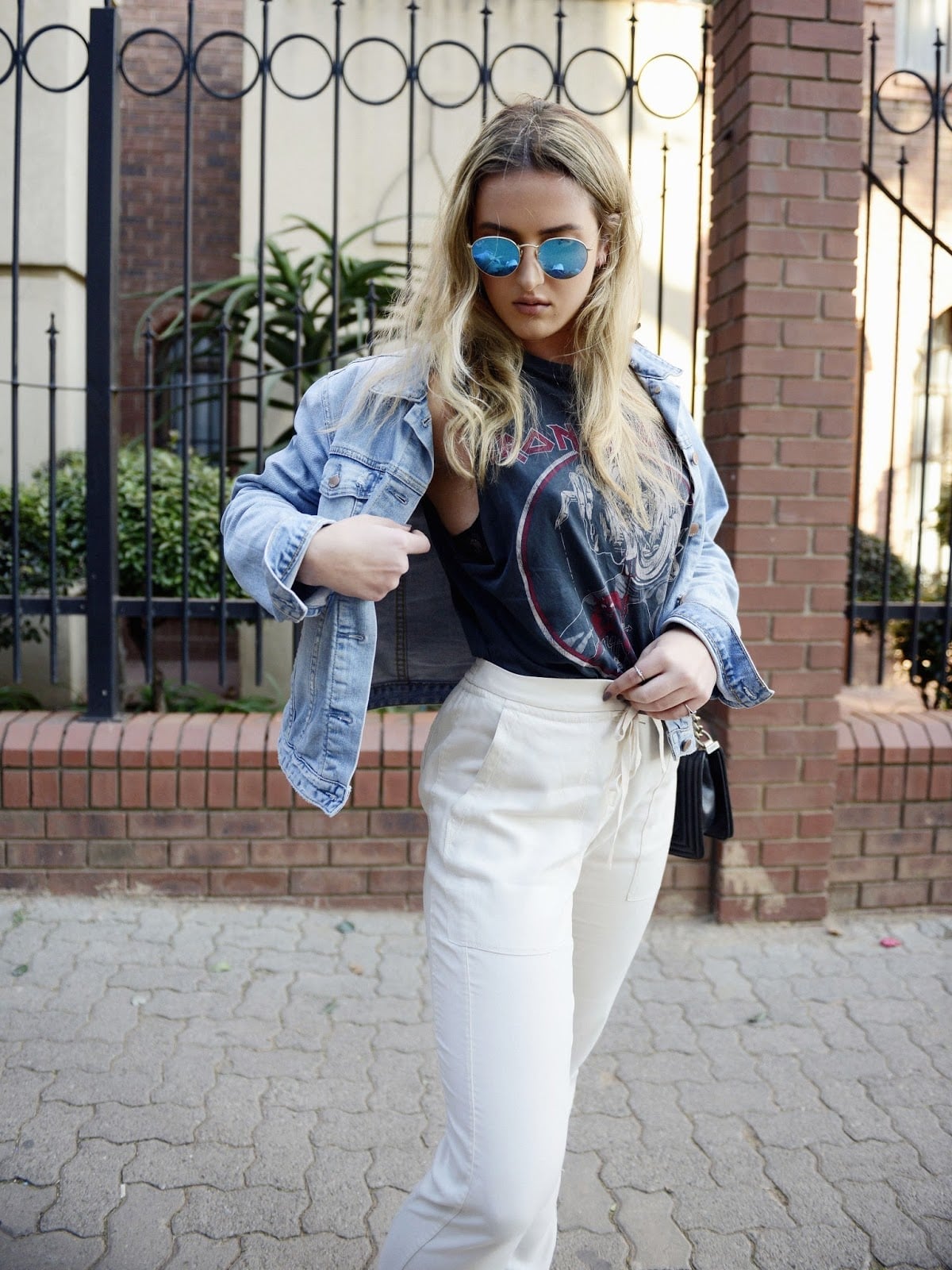 Denim Jacket Over Graphic T-Shirt with Cream Trousers Denim Jacket Over Graphic T-Shirt with Cream Trousers — Trendy Lazy Outfits