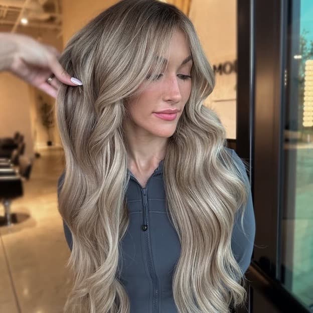 Mid-Back Ash Blonde Balayage With Curtain Bangs — Trendy Light Hair Color