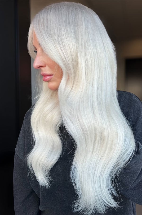 Mid-Back Platinum Blonde With Wispy Bangs — Trendy Light Hair Color