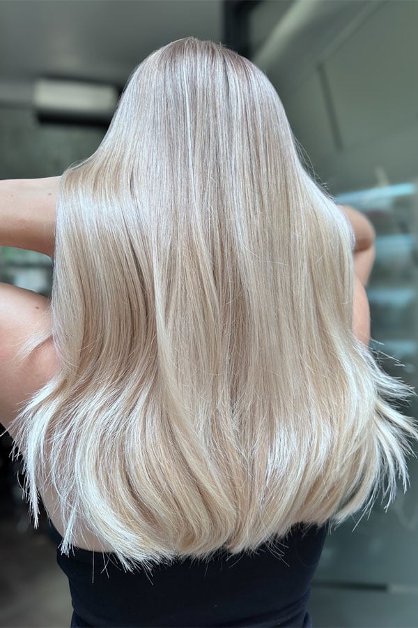Mid-Back Vanilla Blonde With Subtle Highlights — Trendy Light Hair Color