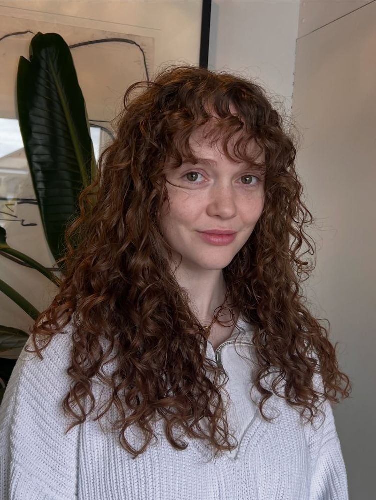 Mid-Back Auburn Curls With Curtain Bangs Mid-Back Auburn Curls With Curtain Bangs — Trendy Long Curly Hair
