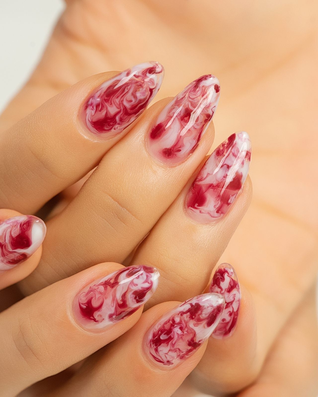Red and White Marble Effect Oval Nails Red and White Marble Effect Oval Nails — Trendy Long Nails