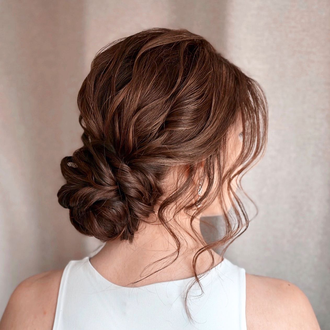Dark Brown Twisted Low Bun Updo Dark Brown Twisted Low Bun Updo — Trendy Messy Bun Updo