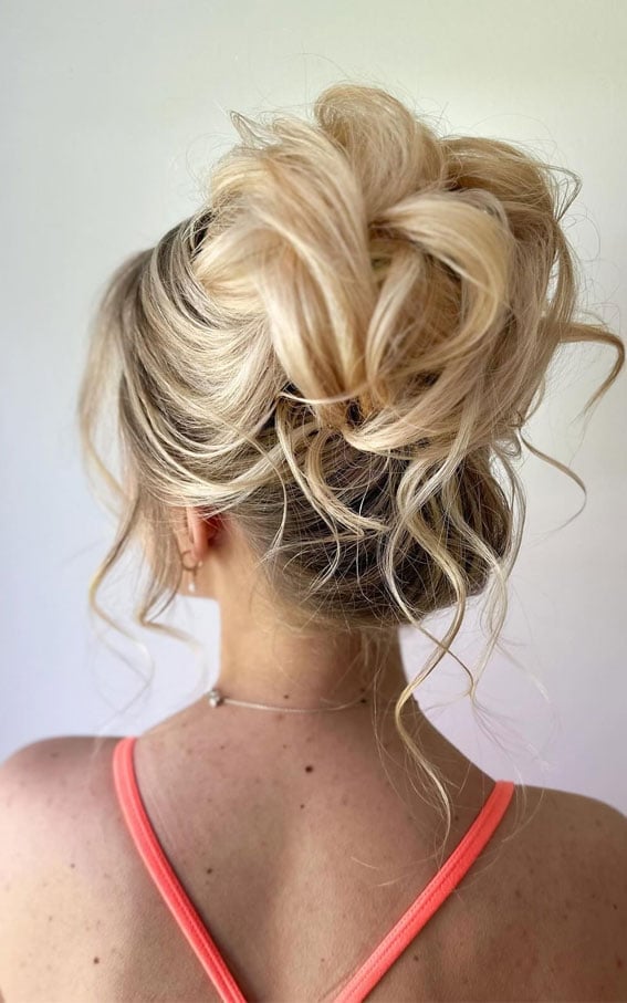 Voluminous Ash Blonde Messy Bun With Dark Roots Voluminous Ash Blonde Messy Bun With Dark Roots — Trendy Messy Bun Updo