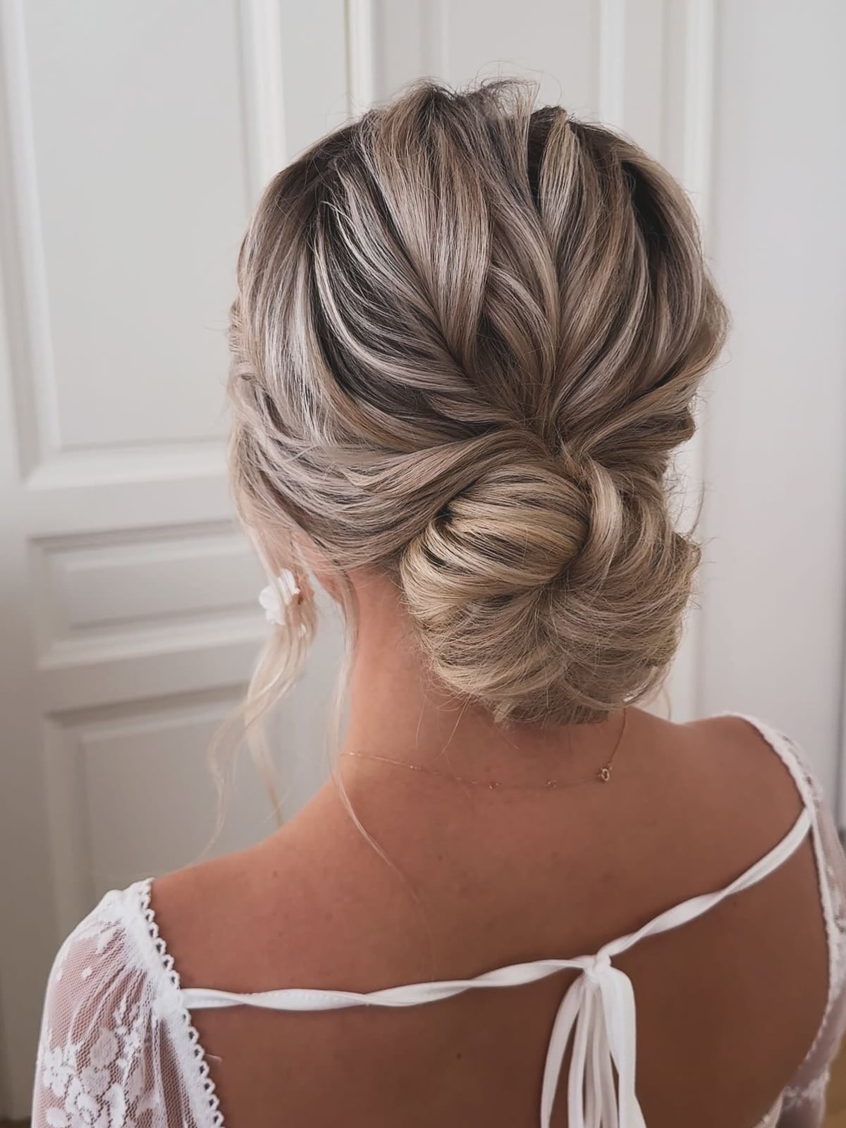 Ash Blonde Messy Bun With Twisted Detail Ash Blonde Messy Bun With Twisted Detail — Trendy Messy Bun Updo