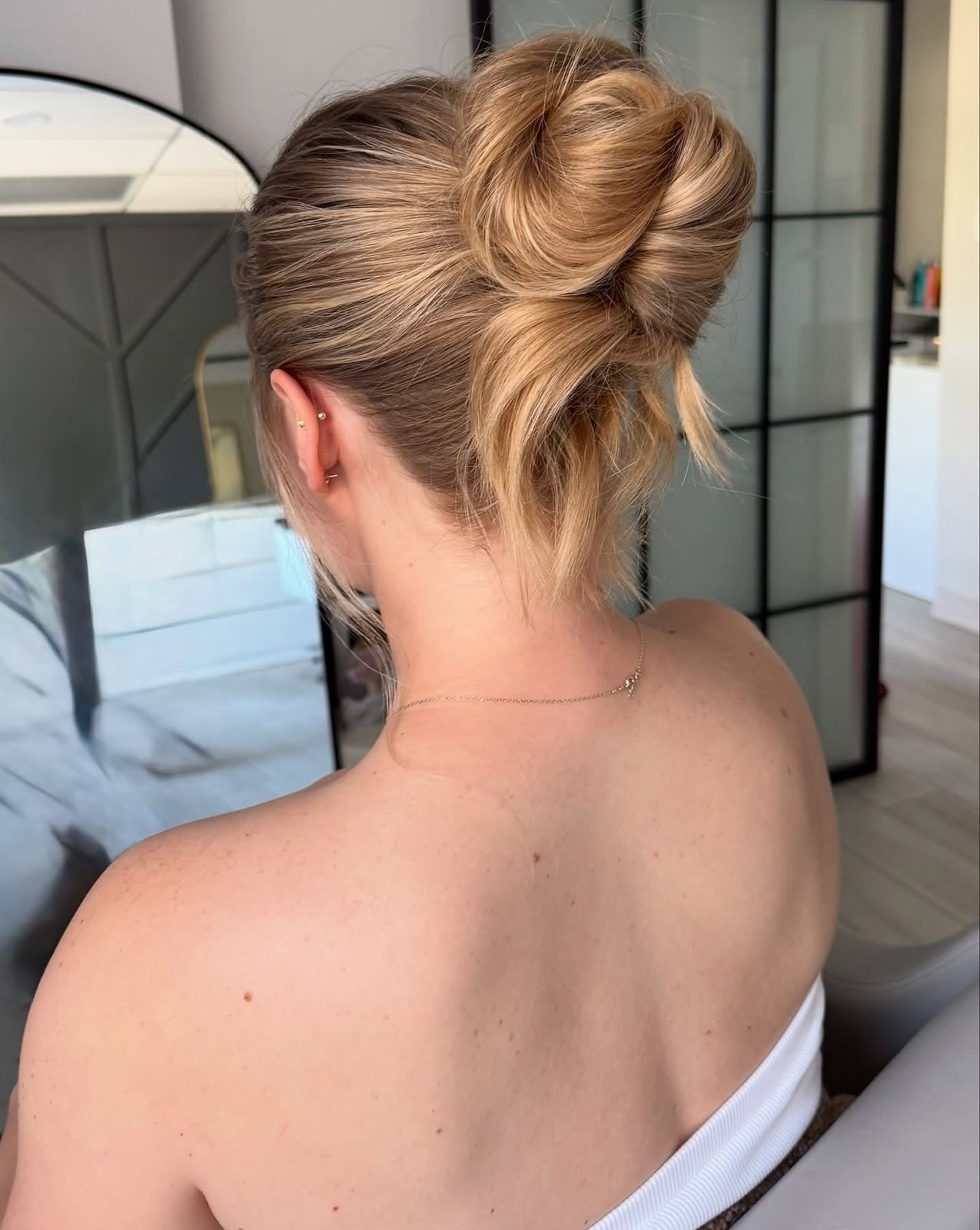 Dark Blonde Messy Bun With Textured Formation Dark Blonde Messy Bun With Textured Formation — Trendy Messy Bun Updo