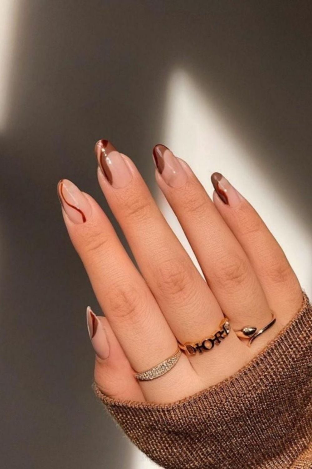 Medium Almond Nude with Thin Brown and Red Lines Medium Almond Nude with Thin Brown and Red Lines — Trendy Minimal Nails