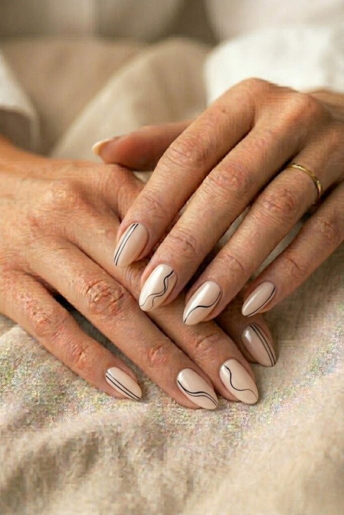 Medium Almond Pale Nude with Black Wavy Lines Medium Almond Pale Nude with Black Wavy Lines — Trendy Minimal Nails