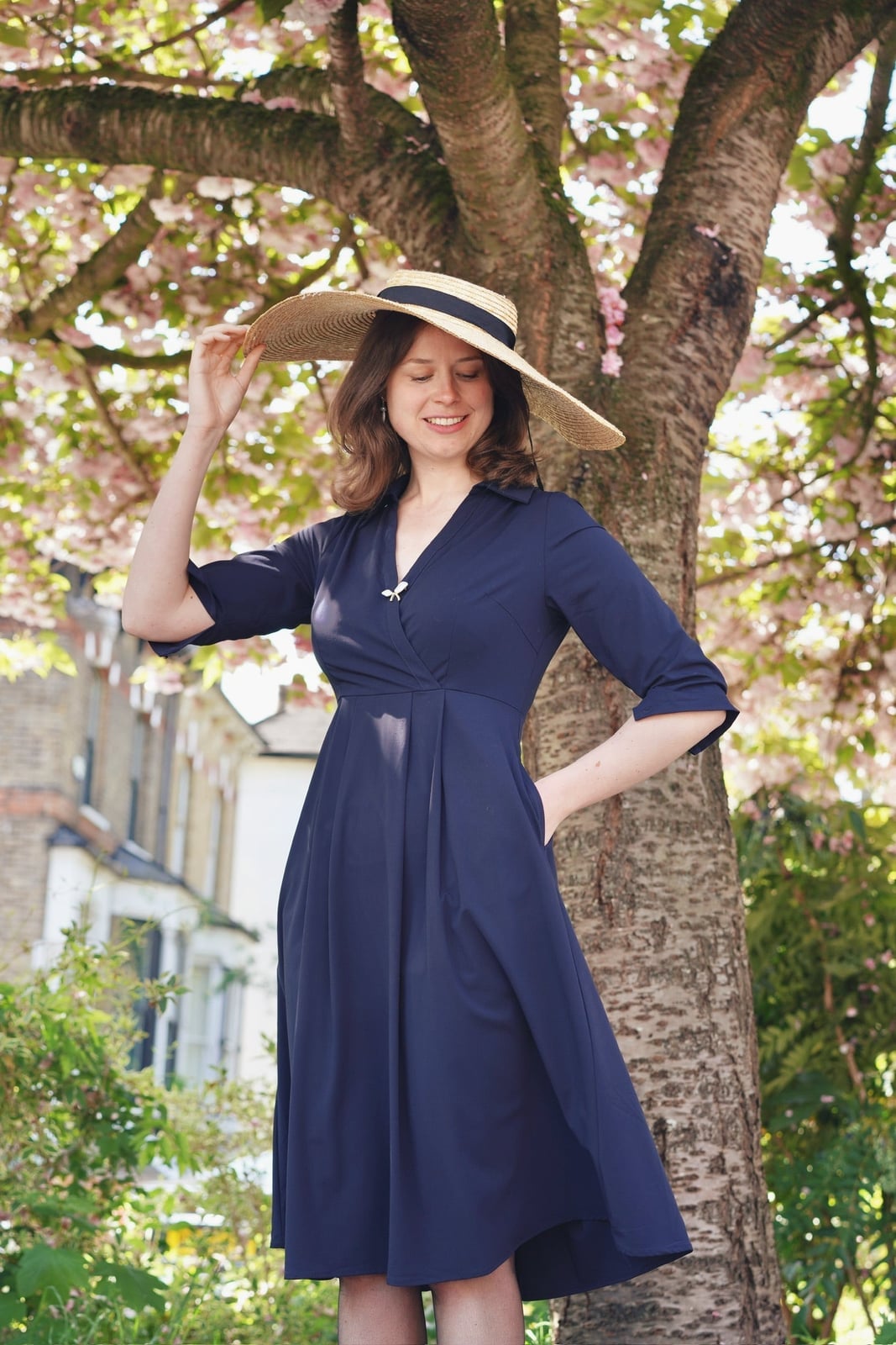 Navy Fit-and-Flare Midi Dress With Straw Hat — Trendy Navy Blue Outfits