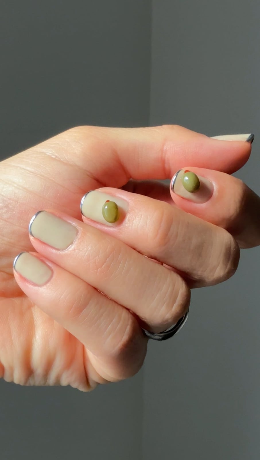 Neutral Base Silver Tip 3D Olive Motif Short Almond Nails — Trendy Olive Green Nails