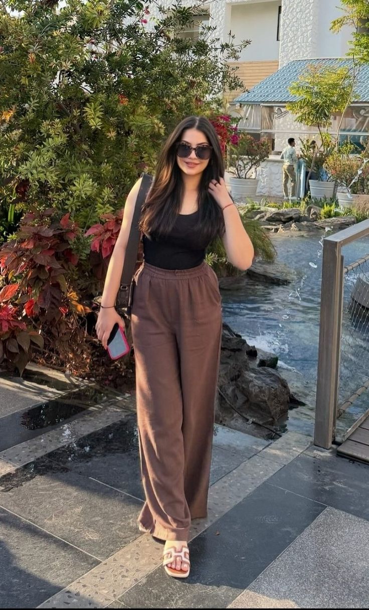 Black Tank Top With Wide Leg Brown Pants Black Tank Top With Wide Leg Brown Pants — Trendy Outfits for Teens