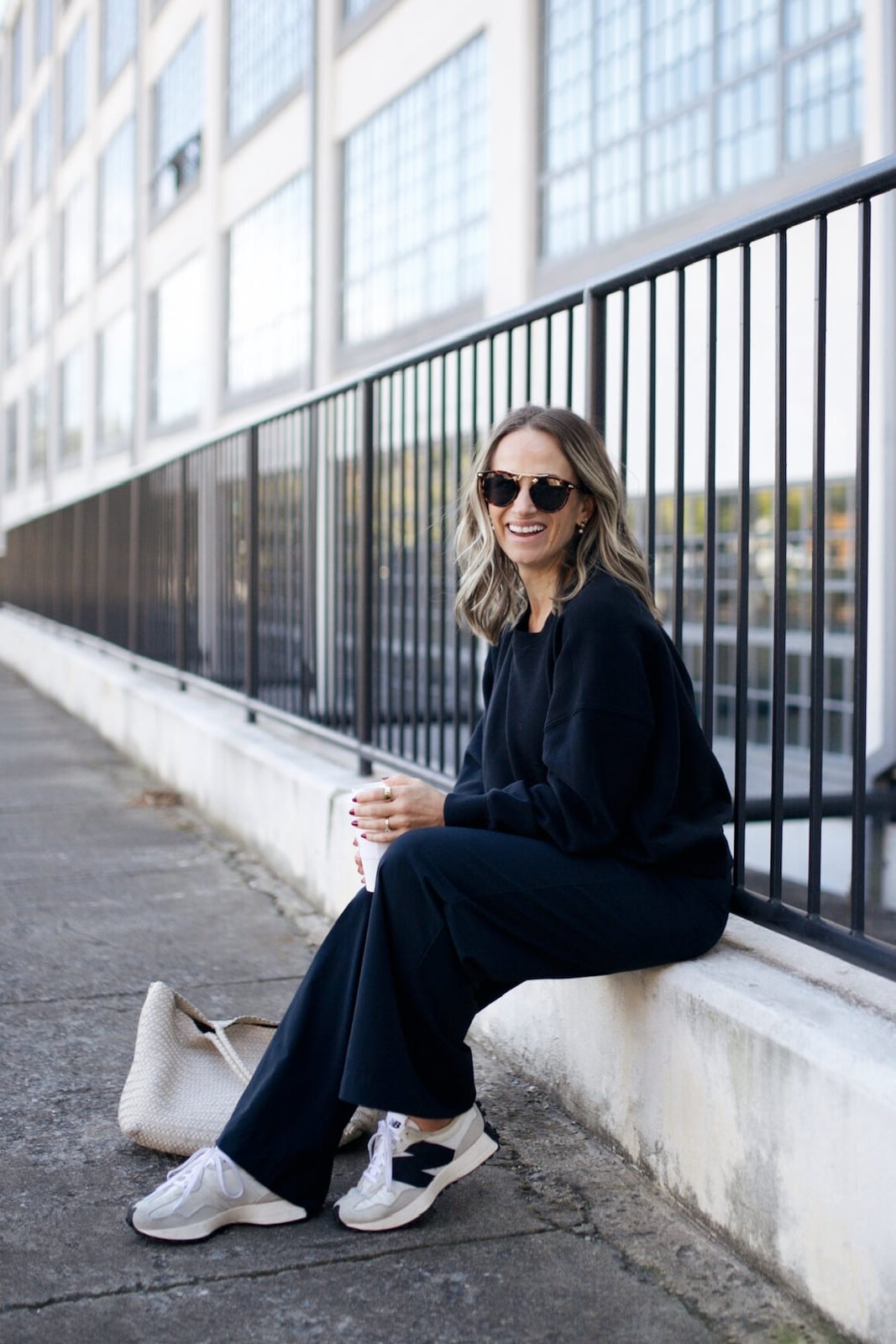Black Sweatshirt with Wide-Leg Pants and Tote Bag — Trendy Pilates Outfits