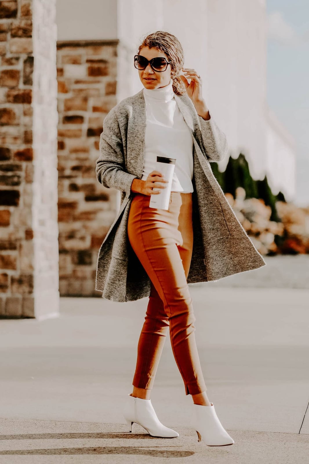 Long Grey Cardigan Over White Turtleneck and Rust Trousers — Trendy Professional Outfits