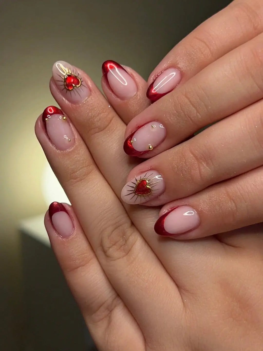 Metallic Red Heart French Medium Almond Nails Metallic Red Heart French Medium Almond Nails — Trendy Red Almond Nails