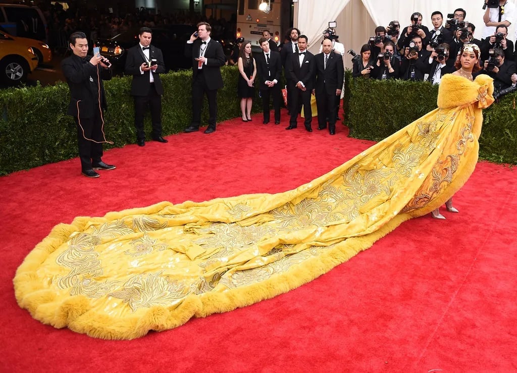 Voluminous Yellow Gown with Gold Embroidery and Fur Trim — Trendy Red Carpet Outfits