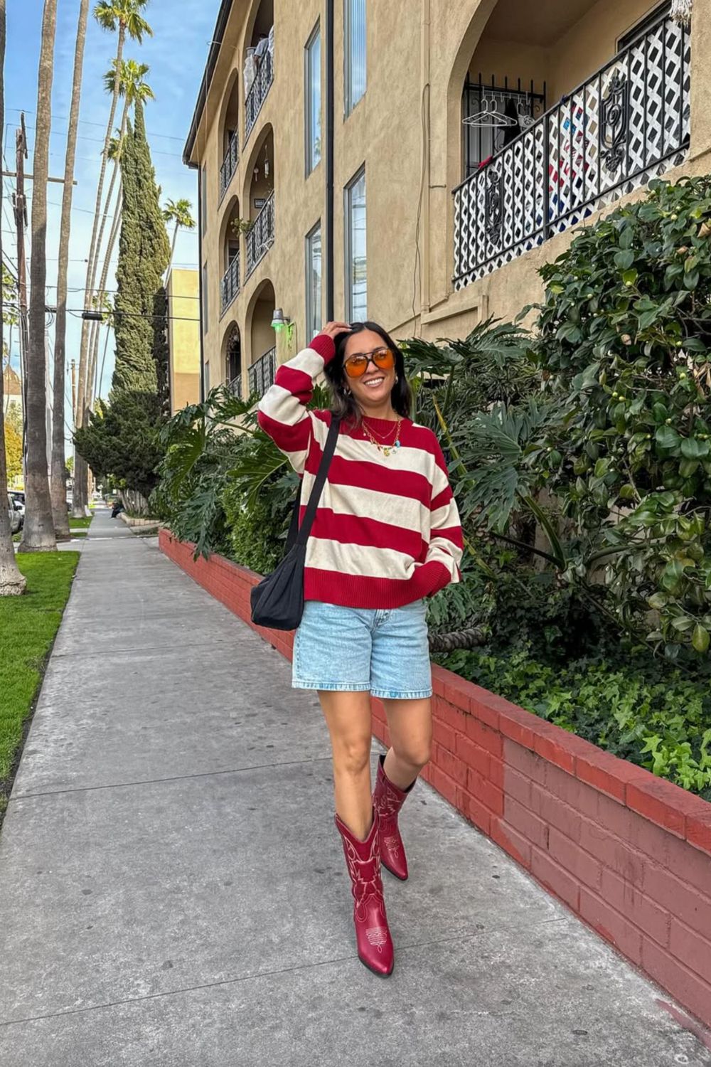 Red Cowboy Boots With Striped Sweater and Denim Shorts — Trendy Red Cowboy Boots Outfit