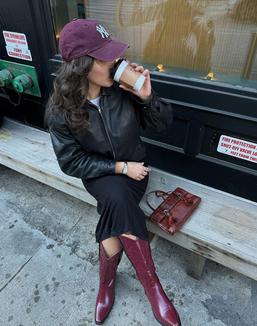 Burgundy Cowboy Boots With Black Leather Jacket — Trendy Red Cowboy Boots Outfit