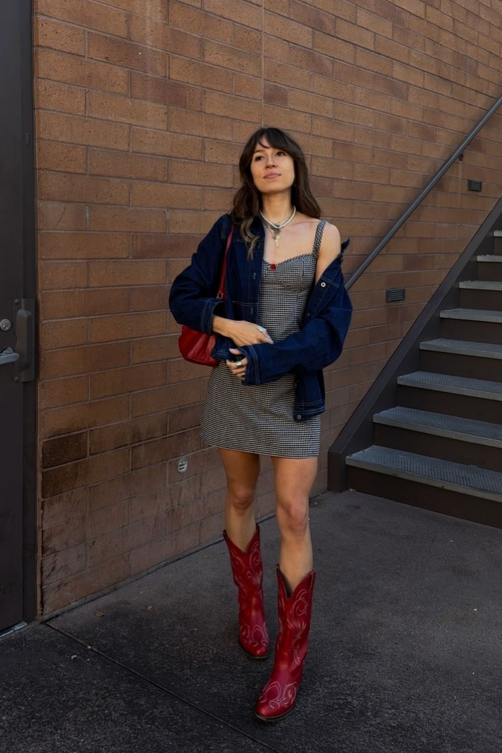Red Cowboy Boots With Gingham Dress and Denim Jacket, Close-Up Take — Trendy Red Cowboy Boots Outfit