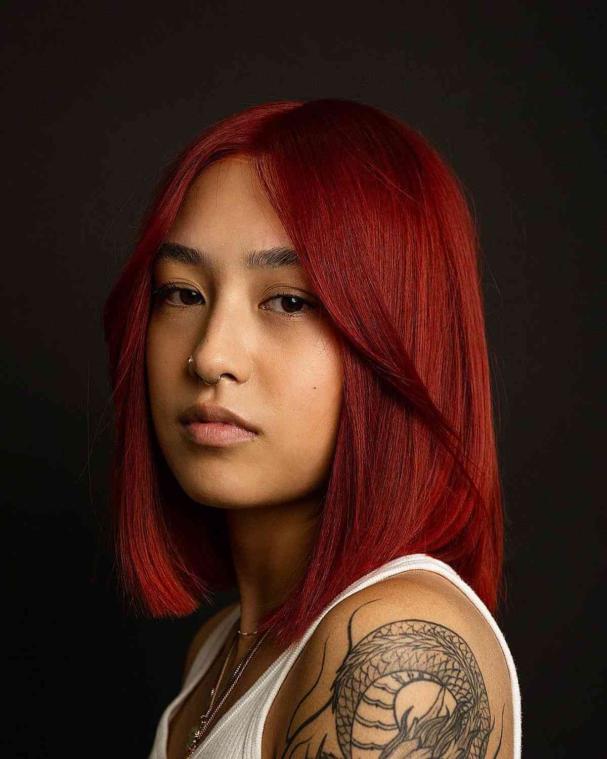 Sleek Ear Length Bob In Vibrant True Red Sleek Ear Length Bob In Vibrant True Red — Trendy Red Hairstyles
