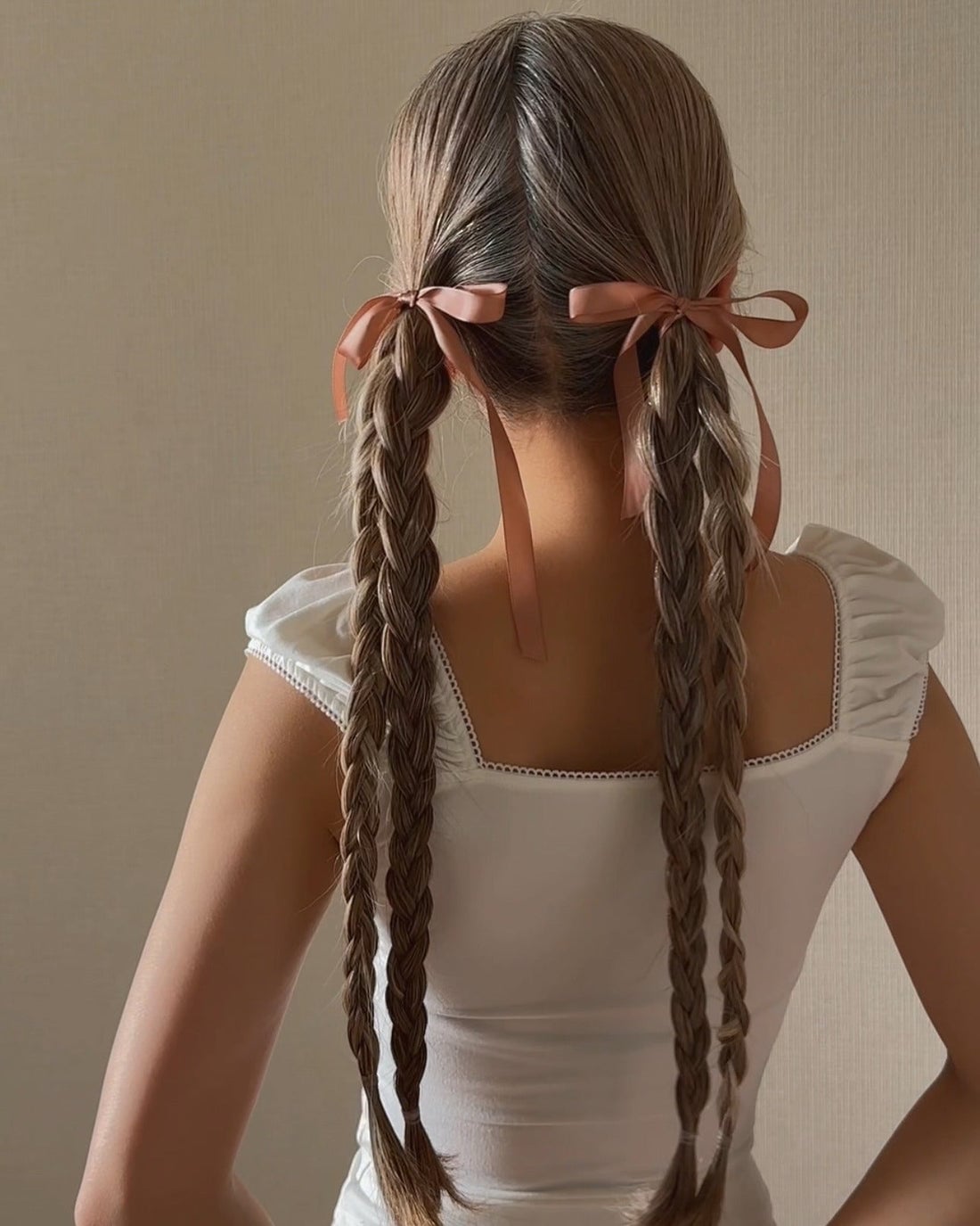 Mid-Back Wavy Blonde Braids With Pink Ribbon Bows Mid-Back Wavy Blonde Braids With Pink Ribbon Bows — Trendy Ribbon Braids