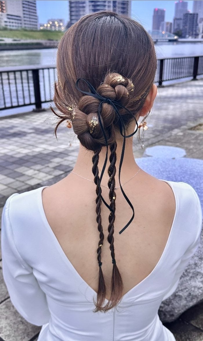 Dark Brown Braided Bun With Ribbon Accents Dark Brown Braided Bun With Ribbon Accents — Trendy Ribbon Braids