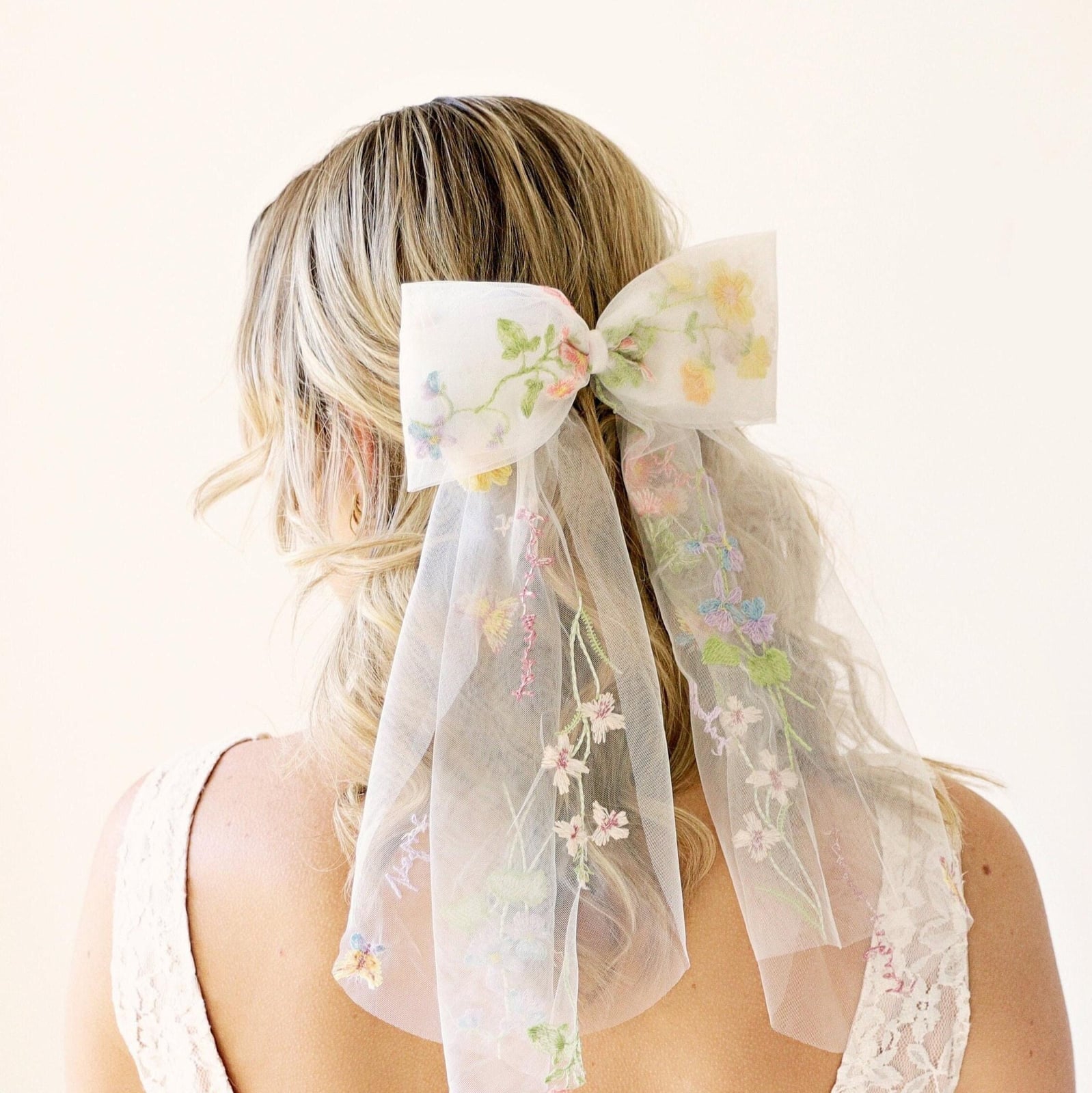 Mid-Back Curls With Braided Accents And Pink Bow — Trendy Ribbon Hair