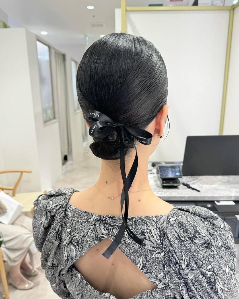 Long Sleek Low Bun With Text Ribbon — Trendy Ribbon Hair