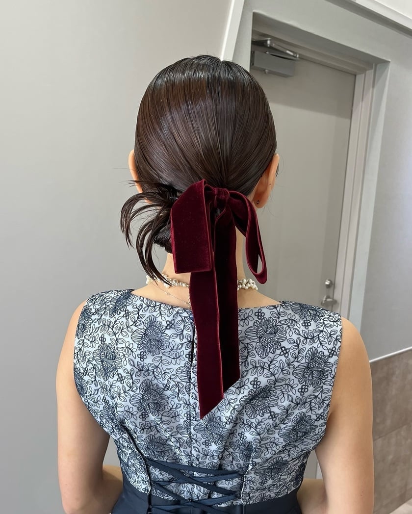 Chin Length Bob Low Ponytail With Red Ribbon — Trendy Ribbon Hair