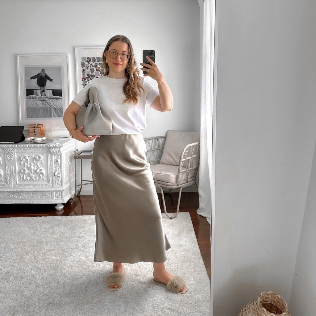Beige Satin Midi Skirt With White T-Shirt And Slides — Trendy Satin Skirt Outfits
