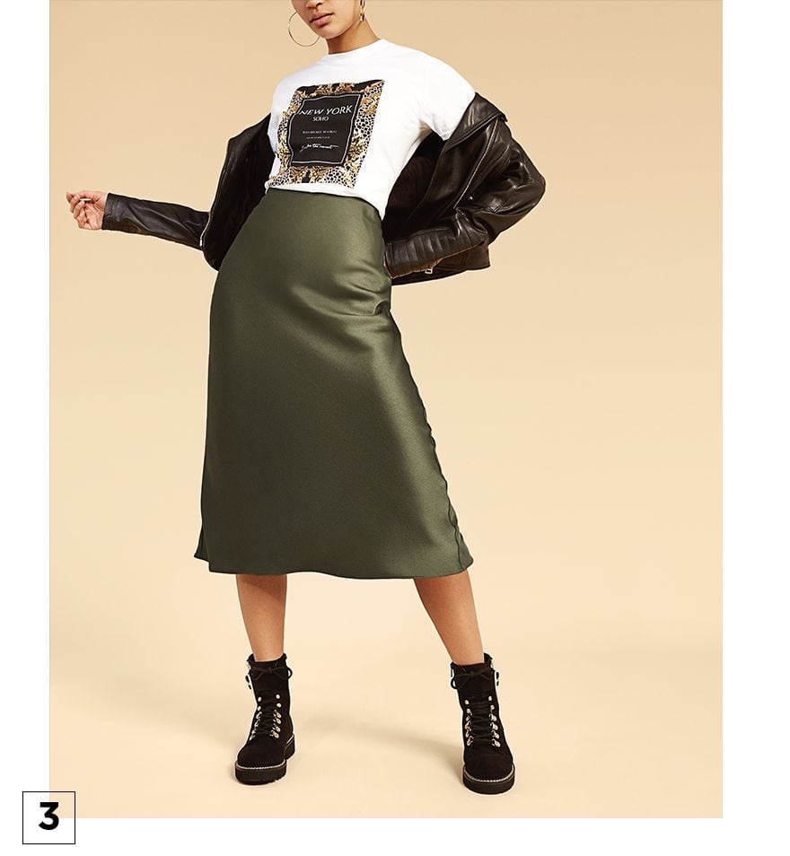 Olive Green Satin Midi Skirt With Graphic Tee And Jacket — Trendy Satin Skirt Outfits