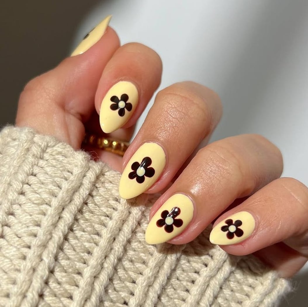 Bright Yellow With Dark Flower Motif Nails — Trendy Short Acrylic Nails