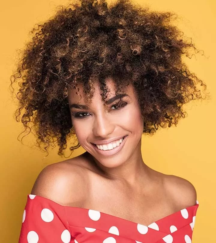 Voluminous Afro With Caramel Highlights — Trendy Short Curly Hair